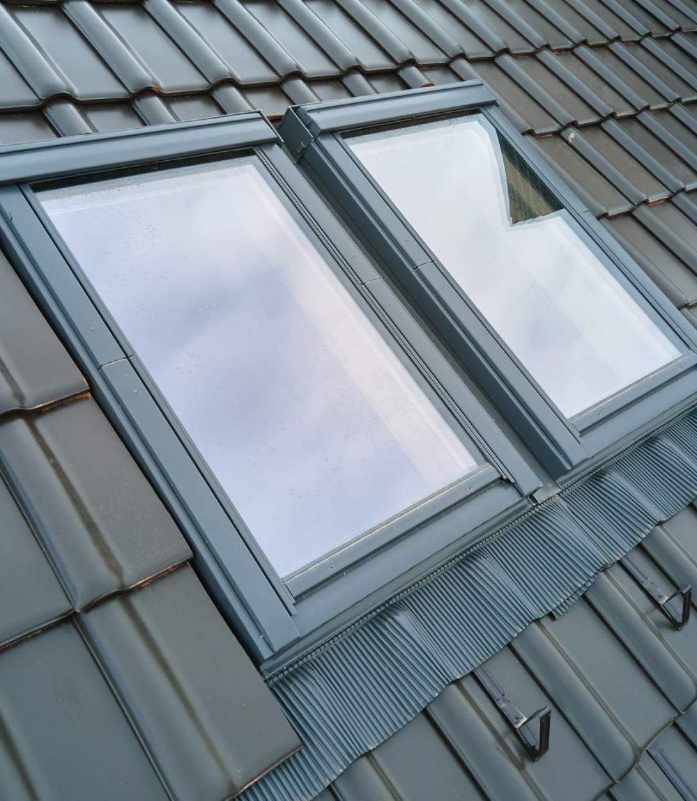 closeup-of-attic-window-on-house-roof-top-covered
