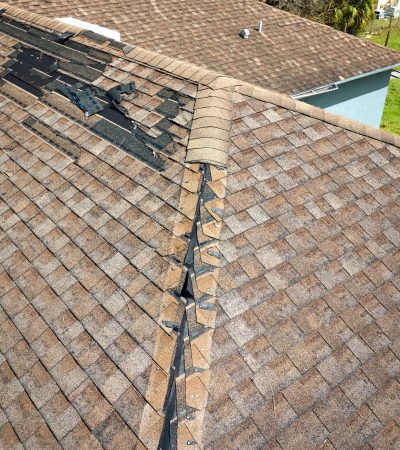 damaged-house-roof-with-missing-shingles-after-hurricane